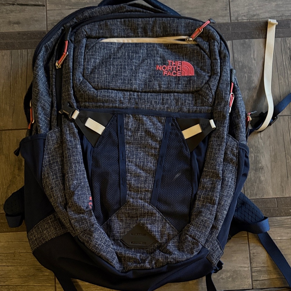 The North Face Women’s Navy Blue and White with pink accents Backpack